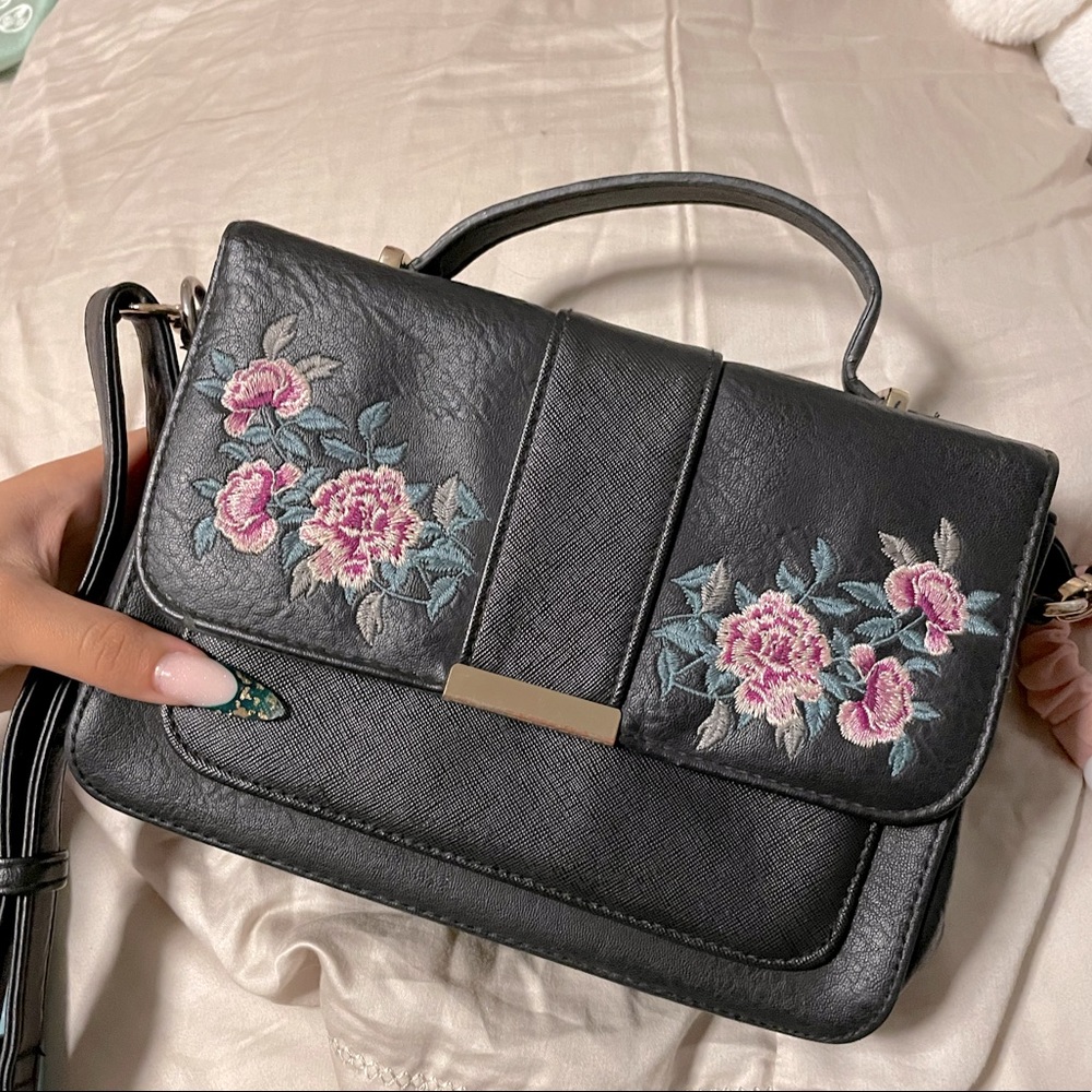 Black crossbody purse with stitched Flowers detail